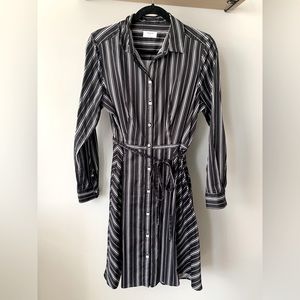 Black and white stripe long sleeve button up dress with tie around strap